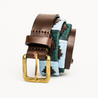 Close-up highlighting the buckle of the Country Direct & Pampeano Royal Signals Leather Polo Belt, featuring light-blue, green, and brown wax thread detailing.